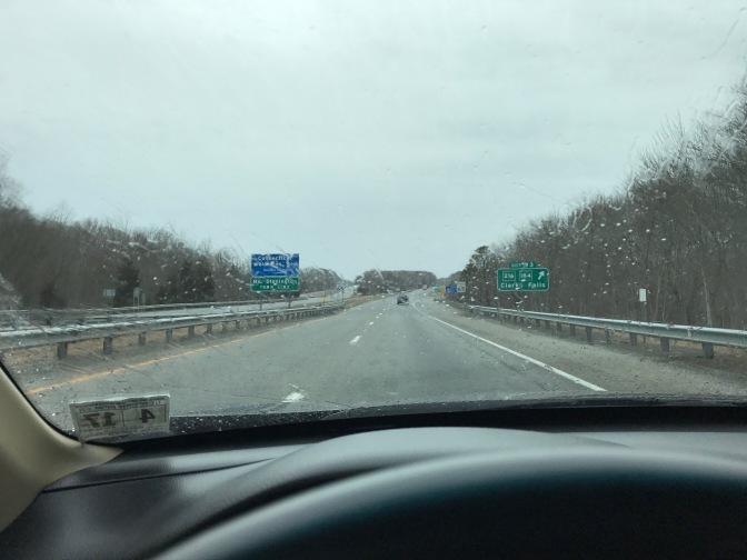 Image of I-95 in the rain, through a car windshield.