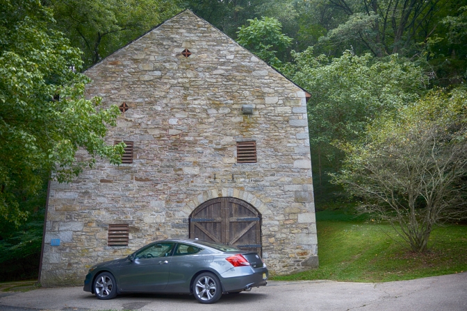 2012 Honda Accord parked in front of stone carriage barn.