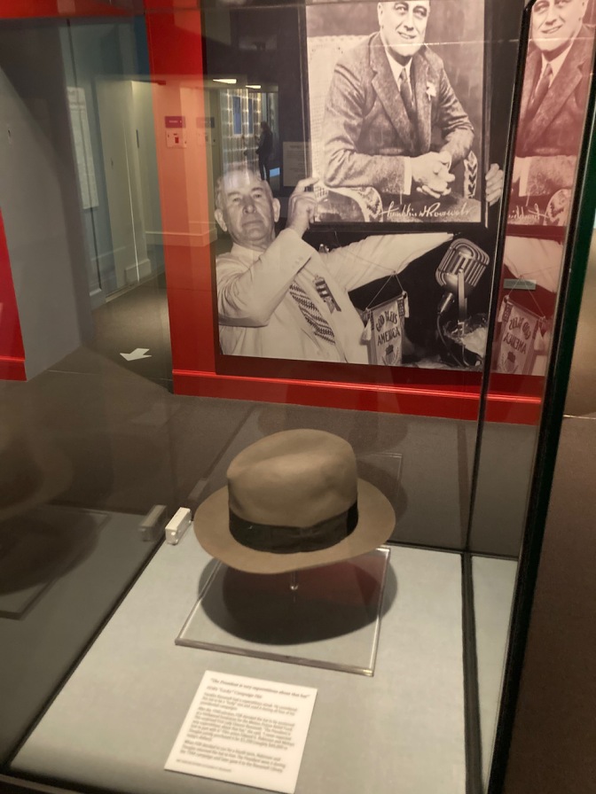 FDR's hat on display in glass case.