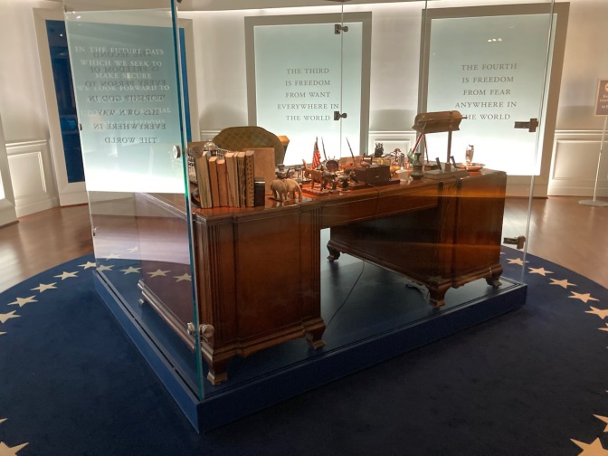 President Roosevelt's desk from the Oval Office on display, with several quotes in background.