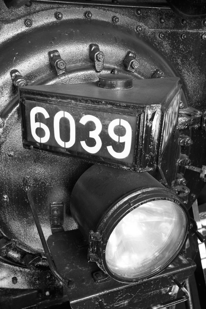 Front of steam engine with number 6039 above light.